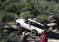 Jon Katz's Range Rover climbs a rock.